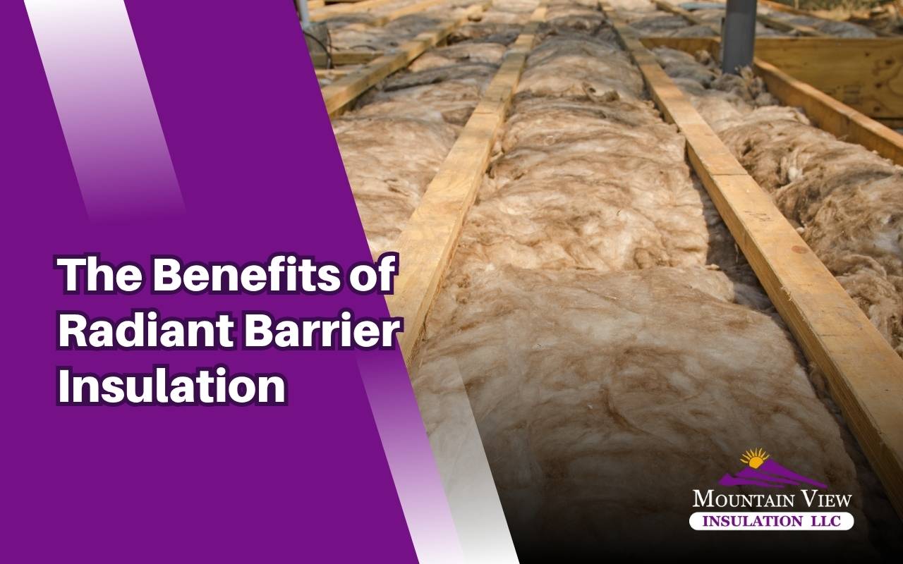 Professional installing reflective insulation for better home energy efficiency